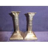 A good pair of early 20th century silver Candlesticks, Corinthian Columnar style on square stepped