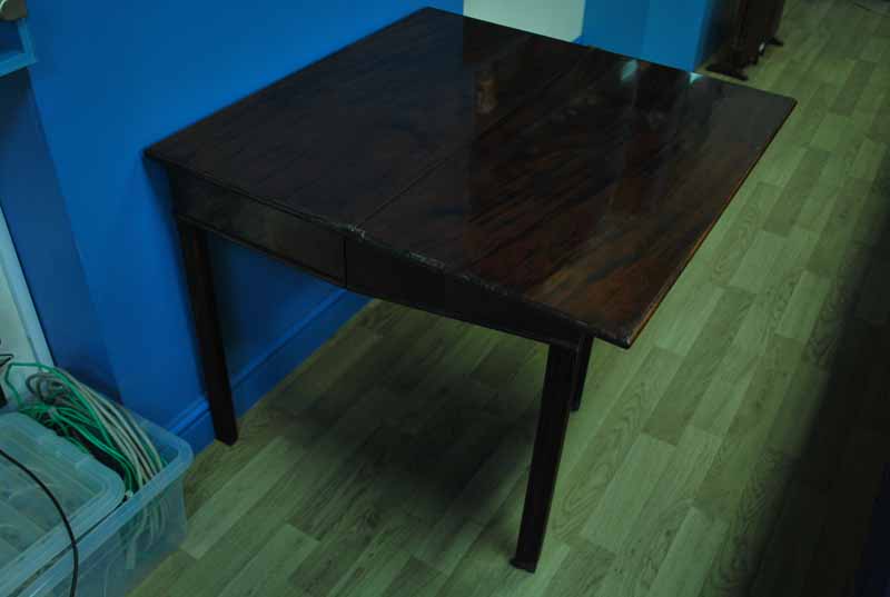 An early 19th century Georgian mahogany fold over Tea Table of rectangular form, hinged moulded edge