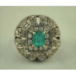 An Art Deco emrald and diamond set platinum orientalist Dress Ring, the Colombian Emerald possibly