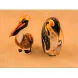 A Royal Crown Derby Penguin and Chick paperweight, gold stopper, 12.5 cm H unboxed; together with