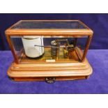 A late 19th/early 20th century mahogany and glass cased barograph by J.Hicks of London,