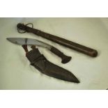 A WWII period Kukri complete with Scabbard and Knives, plus an early 20th century police truncheon