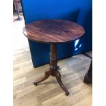 19th Century circular occasional table on turned pedestal to tripartite base. 49cm dia