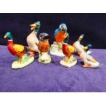 Beswick pottery, two Kingfishers, a graduated set of three Mallards and two Cock Pheasants