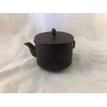 A Japanese Meiji period cast iron sake pot/teapot & cover decorated with pine trees, the lid with