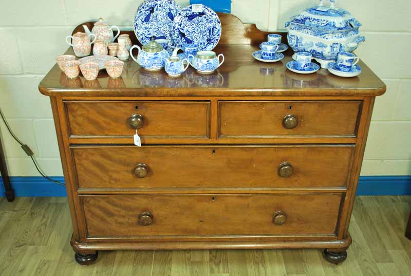 A Victorian mahogany two over two drawer cedar lined Wash Stand on bun feet