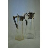 Two silver mounted continental Spirit Jugs one c1910 18cm high, the other with naturalistic
