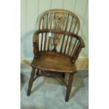 A Yew and Elm Windsor Chair with low back and Crinoline Stretcher