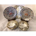 A pair of silver lustre and iron red tea plates with central lion motif (possibly spode) plus two