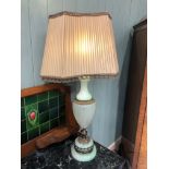 An early to mid 20th century onyx Lamp Base with brass mounts complete with original shade, 79cm