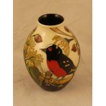 A small Moorcroft Pottery numbered edition vase in the Scarlet Robin pattern by Nicola Slaney,