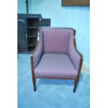 An Edward VII mahogany framed armchair, with satinwood banding and fleur de lys upholstery, on