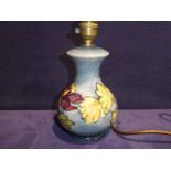 A Moorcroft Pottery Table Lamp Base, tubeline decorated with Aquilegia on pale blue ground, 17cm