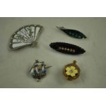 A small group of Brooches and Badges including a Primrose League lapel badge, an enamel and silver