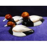 Beswick pottery, a graduated set of three Pochard, approved by Peter Scott, number 1520