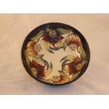 A Moorcroft Pottery large fruit bowl shape 201/10 in the Tiger Lily pattern year plate 1998,