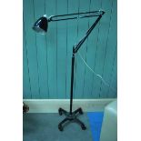 An unusual mid 20th century angle poise Standard Lamp on cast iron, counterweighted base on casters