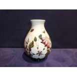 A modern Moorcroft Pottery Vase, oviform, tubeline decorated in the Bramble Revisited design,