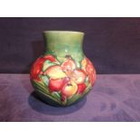 A mid 20th century Walter Moorcroft Pottery Vase, onion shape, tubeline decorated with Freesia style