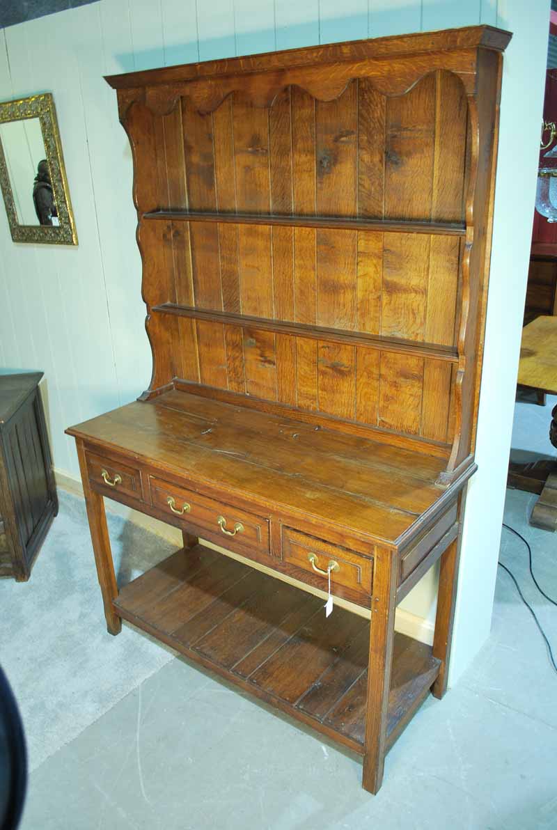 A George III style handmade oak Dresser with two shelf Plate Rack over a three drawer Pot Shelf,