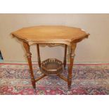 A late victorian mahagony occasional table with octagonal moulded edge, galleried under shelf on