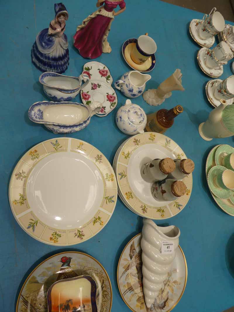 A mixed lot of ceramics to include plates, wall pocket, dishes, figurines & pheasant decorated ware