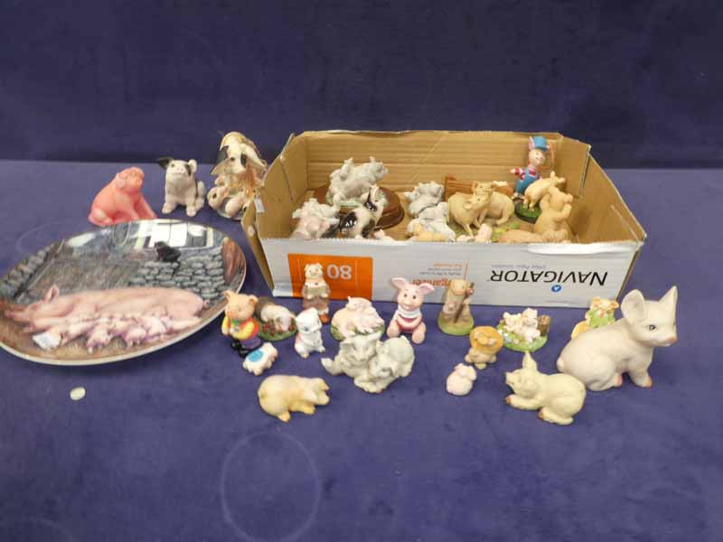 A quantity of ceramic and resin small pig models, plate, chamber pot etc