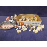 A quantity of ceramic and resin small pig models, plate, chamber pot etc