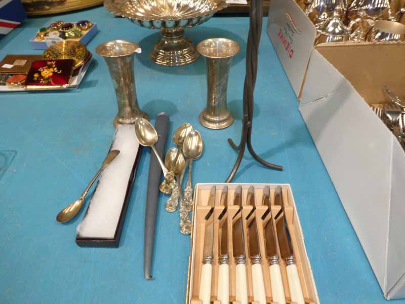 A pair of silver posy vases, silver teaspoon, candle stand, teaspoons and set of cake knives