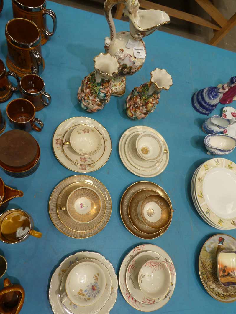A Capodimonte garniture jug and vases and six German/Bavaria porcelain trios