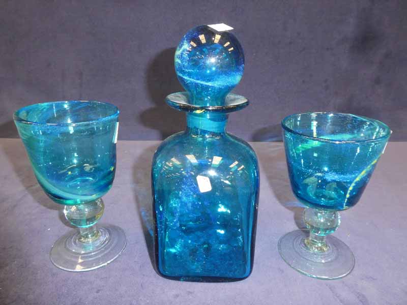 Michael Harris and Eric Dobson, three items of blue Mdina glass, square sided decanter and a pair of