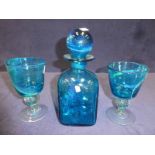 Michael Harris and Eric Dobson, three items of blue Mdina glass, square sided decanter and a pair of