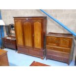 An early 20th Century mahogany three piece bedroom suite comprising double wardrobe, three drawer