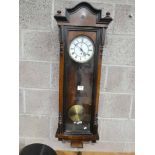A Victorian walnut and ebonised cased Vienna style wall clock, single weight regulator