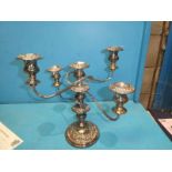 A silver plate on copper five branch table candelabra