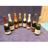 Nine bottles of mixed white and rose sparkling wines