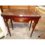 A Victorian style mahogany flip over and turn tea table with single frieze drawer , taper turned