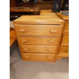 A mid century small plywood chest of four drawers