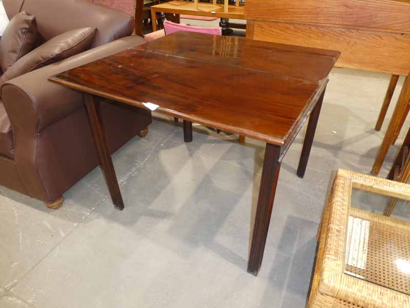 An early 19th century Georgian mahogany fold over Tea Table of rectangular form, hinged moulded edge