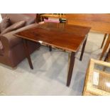 An early 19th century Georgian mahogany fold over Tea Table of rectangular form, hinged moulded edge