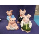 A set of four Wade Nat West pigs. Mother, father, girl & baby