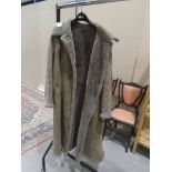 A lady's full length sheepskin coat by Morlands with belt