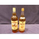 A single bottle of Bells extra special Scotch whisky, 100cl and a single bottle of famous Grouse,