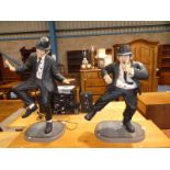 A large pair of cast figures as Jake and Ellwood - The Blues Brothers approx 3ft tall