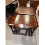 A dark wood nest of 3 occasional tables and small media cabinet