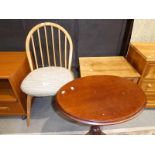 A mahogany oval top wine table on tripod base, modern and an Ercol light ash spindle back chair