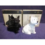 Two Buchanans, black & white Whisky decanters as seated Scottish & West Highland terriers - both