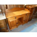 A Victorian satinwood wash stand with gallery back, two drawers over a kneehole centre flanked by