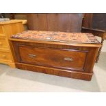 A Victorian mahogany wardrobe base altered to create a window seat with storage