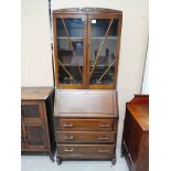 A mid century oak bureau/display cabinet